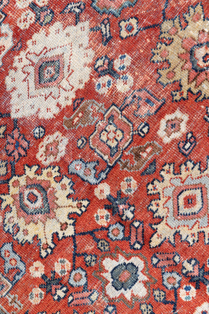 This a Vintage Persian Rug from Mahal in Persia. This hand woven Carpet features a lovely red ground with an all over design.