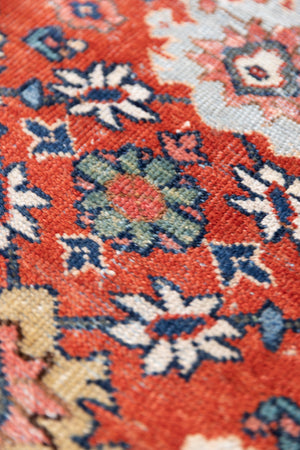 This a Vintage Persian Rug from Mahal in Persia. This hand woven Carpet features a lovely red ground with an all over design.