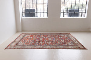 This a Vintage Persian Rug from Mahal in Persia. This hand woven Carpet features a lovely red ground with an all over design.