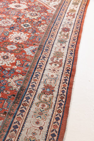 This a Vintage Persian Rug from Mahal in Persia. This hand woven Carpet features a lovely red ground with an all over design.