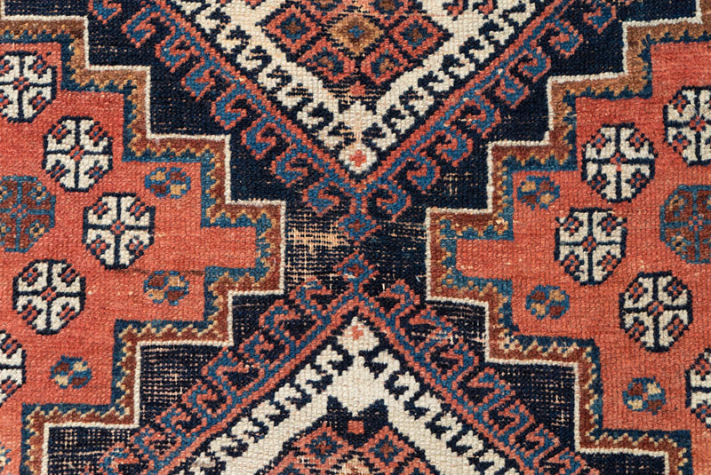 Vintage Madeline Afshar rug featuring stylised designs - Medilion View