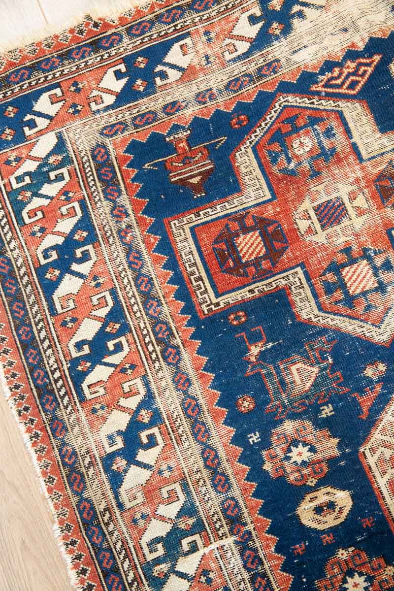 Antique Yuri Rug with Vibrant Geometric Designs - Guard border